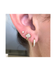 ear with diamond stud earring and accented jewelry