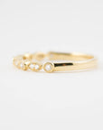 side view of yellow gold ring with diamonds
